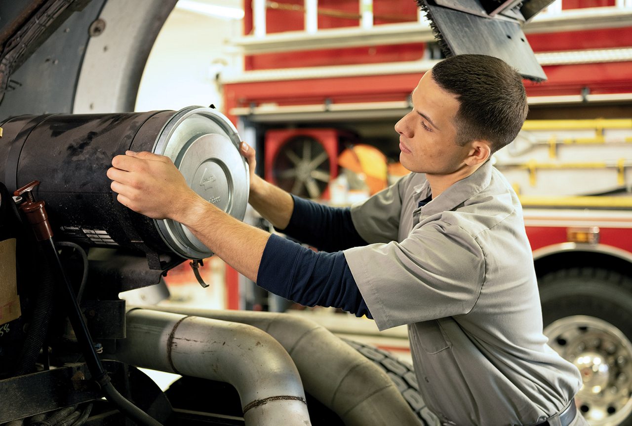 Farmer in front of a tractor on a farm