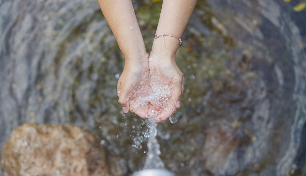 hands in water