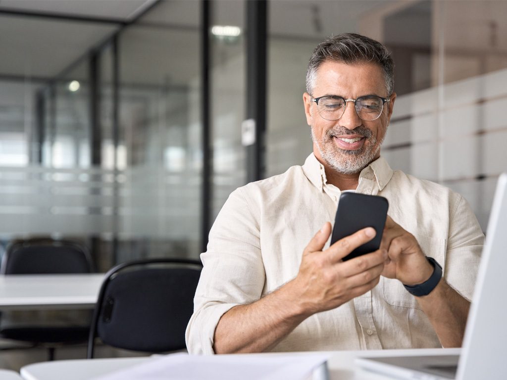 man typing on the phone