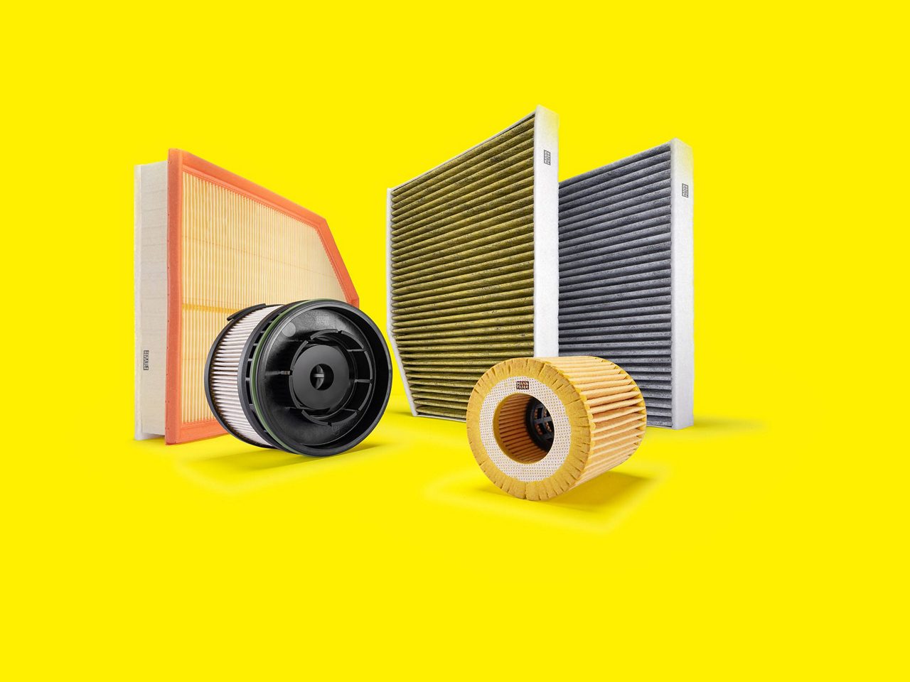 Filtros coches y furgonetas MANN-FILTER, y filtros aire, habitáculo y aceite, con fondo amarillo