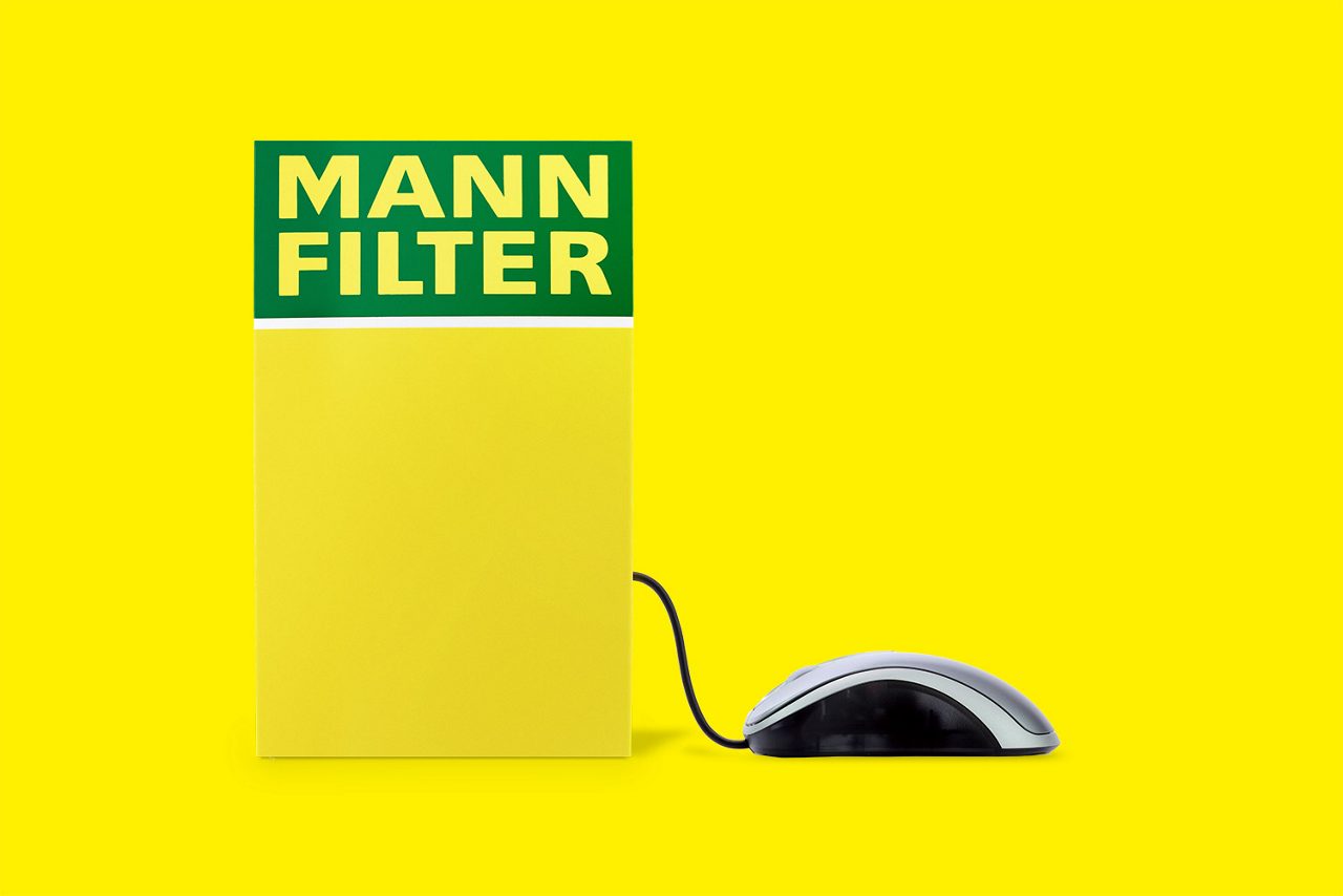 A yellow MANN-FILTER box with a computer mouse connected to it, representing the download hub