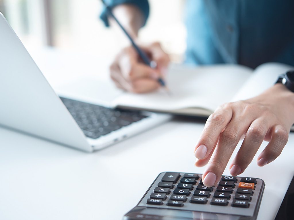woman using calculator