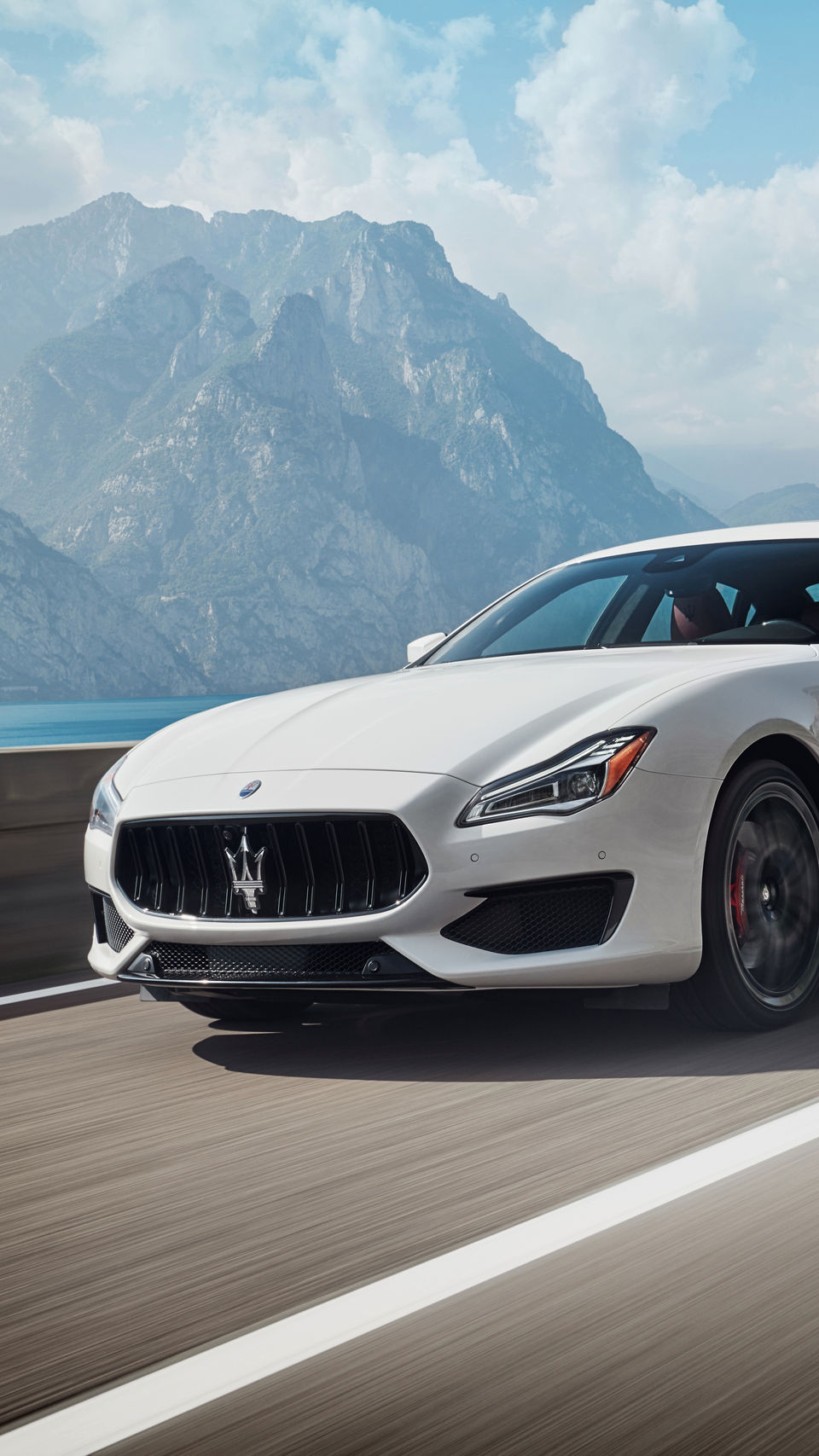 Maserati Quattroporte GTS – the luxury sedan in Bianco color on the road