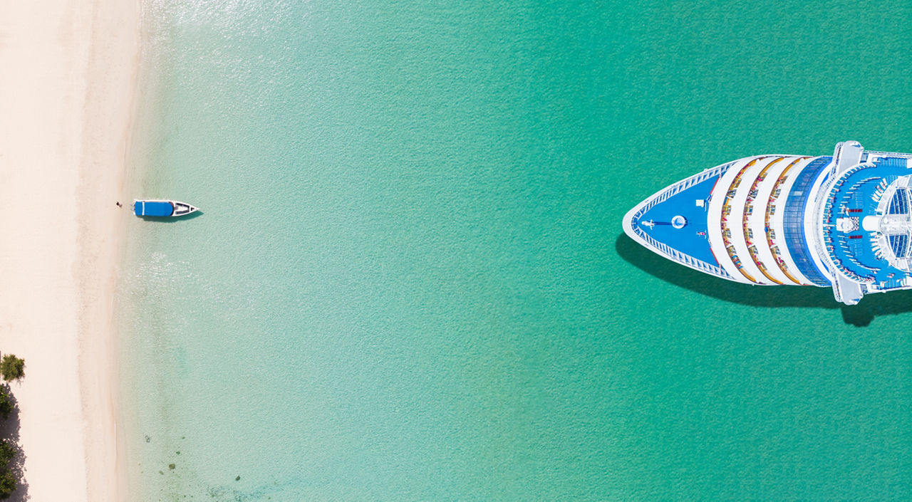 Beautiful white cruise ship  luxury cruise near sand beach and blue sea  concept tourism travel on holiday take a vacation time on summer.