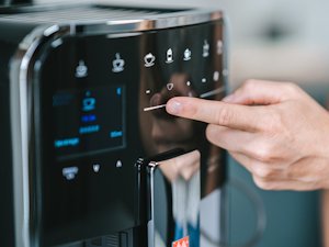 Melitta_Barista_Detail.png – Melitta® close-up of illuminated Barista TS Smart® control panel being touched.