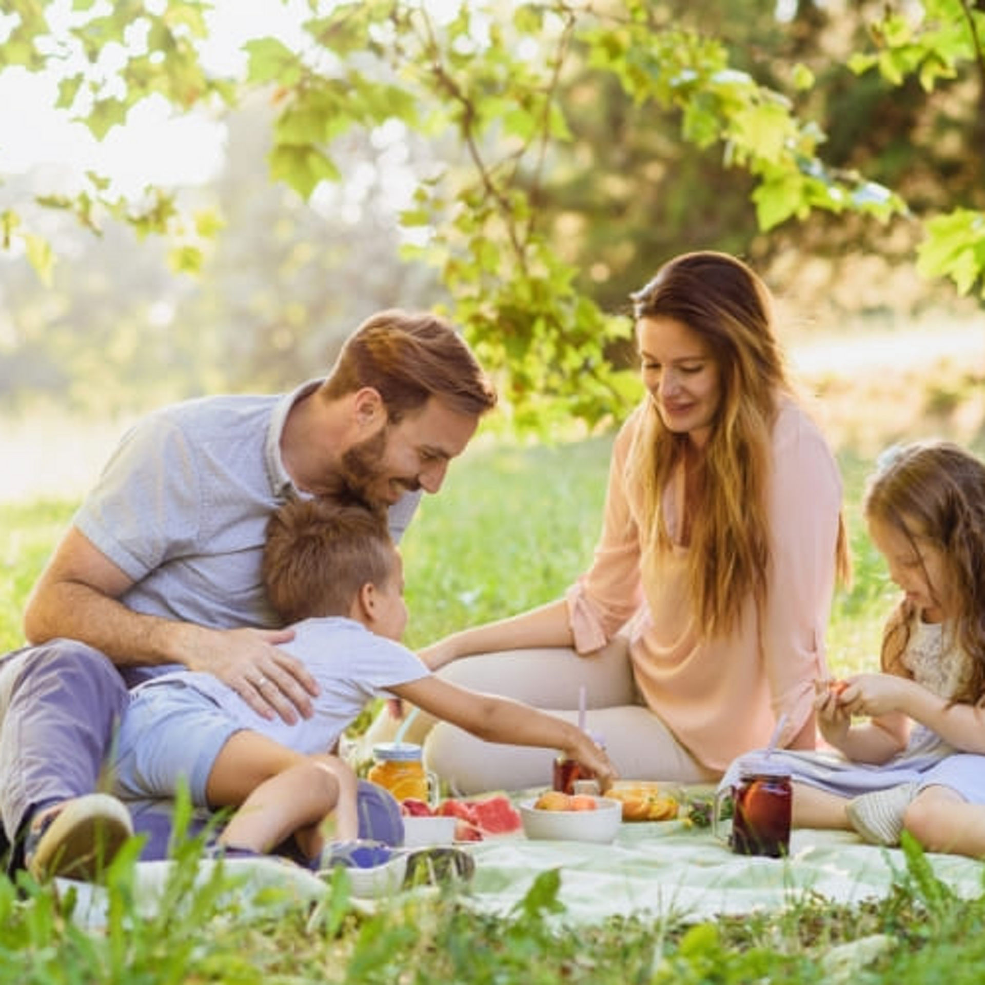 Enjoying Picnic Basket fruits on a sunny summer day in nature