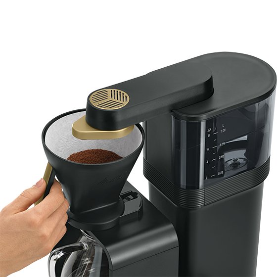 Melitta® epour Filter Coffee Maker 6772303 – pouring coffee grounds into open filter