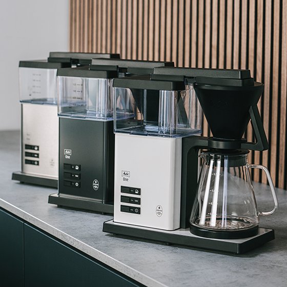 Melitta® One Filter Coffee Maker side view 6780186 range view three coffee machines standing next to each other on a kitchen board