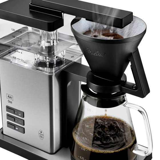 Melitta® One Filter Coffee Maker side view 6780188 product shot white background coffee mug filled with coffee hot water dripping
