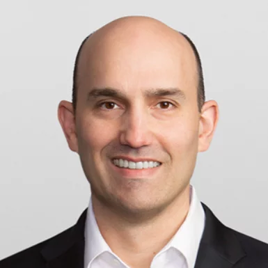 Smiling bald man in business suit portrait