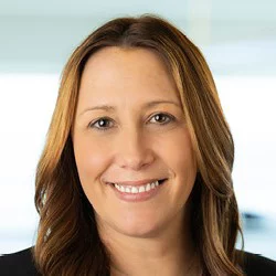 Professional woman smiling in modern office