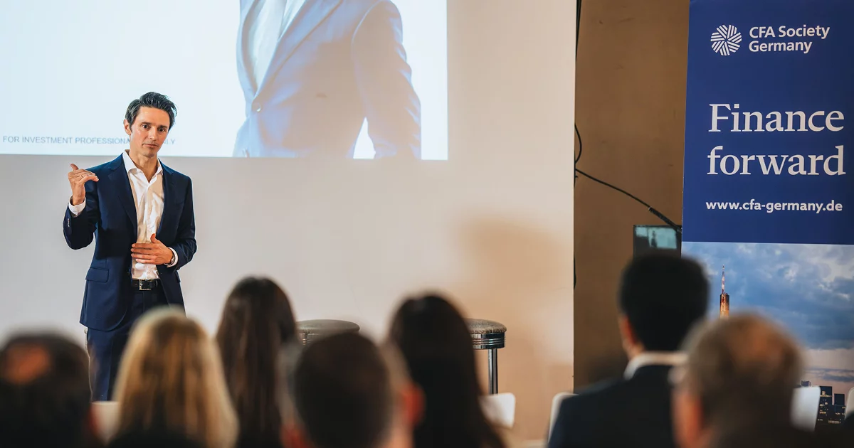 Business speaker presenting at CFA Society Germany
