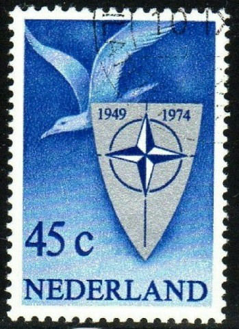 1974 Dutch NATO stamp, depicting a seagull, a shield and the NATO logo