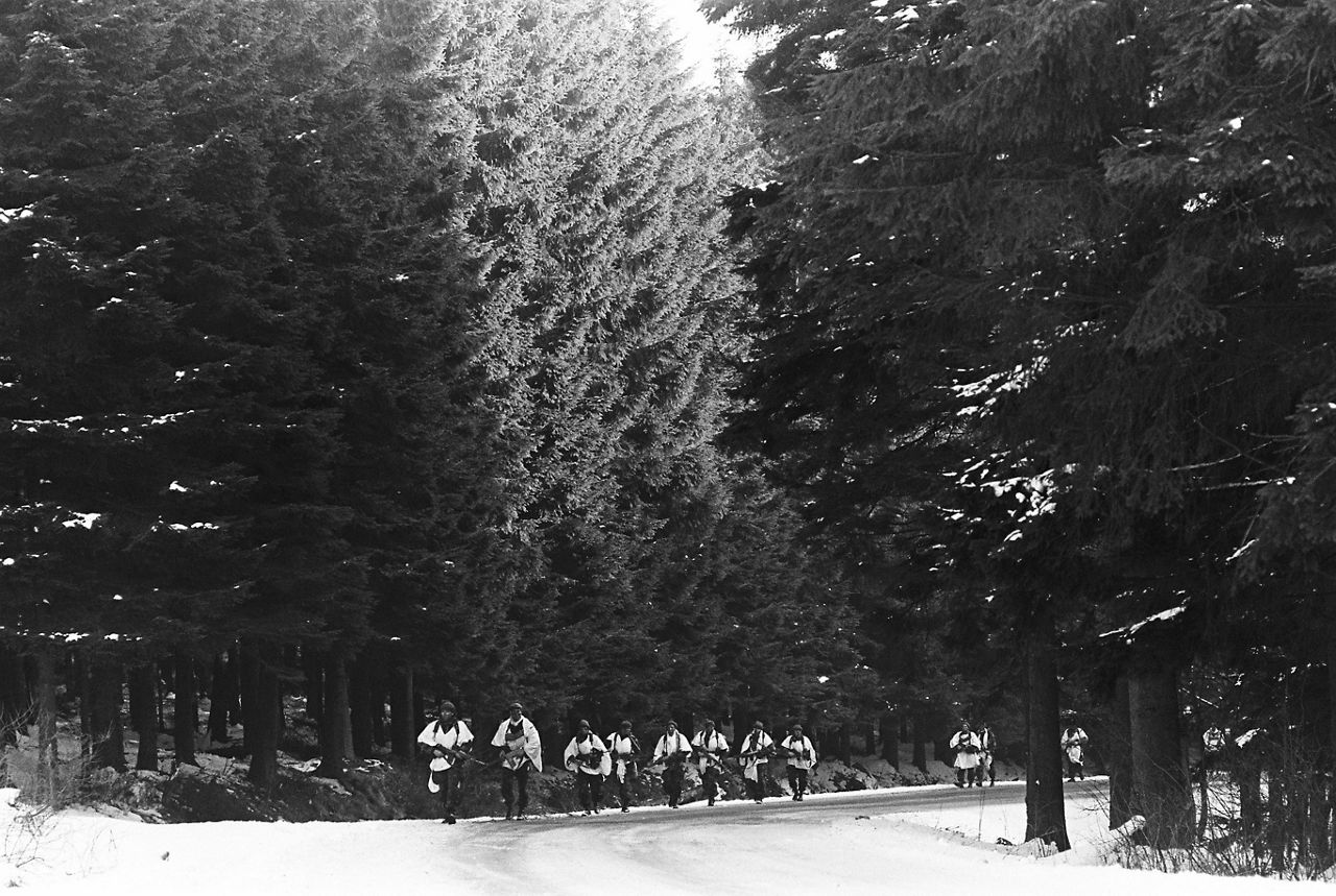 Soldiers march through the forest during exercise Frozen Bulk in Belgium in February 1981.