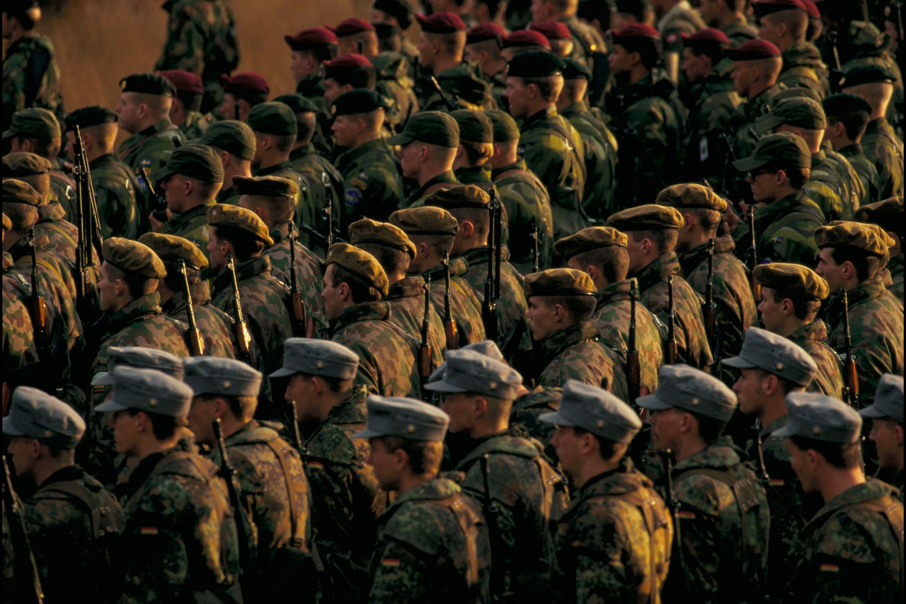 The sun sets behind Allied and partner troops during exercise Cooperative Spirit in the Netherlands. 