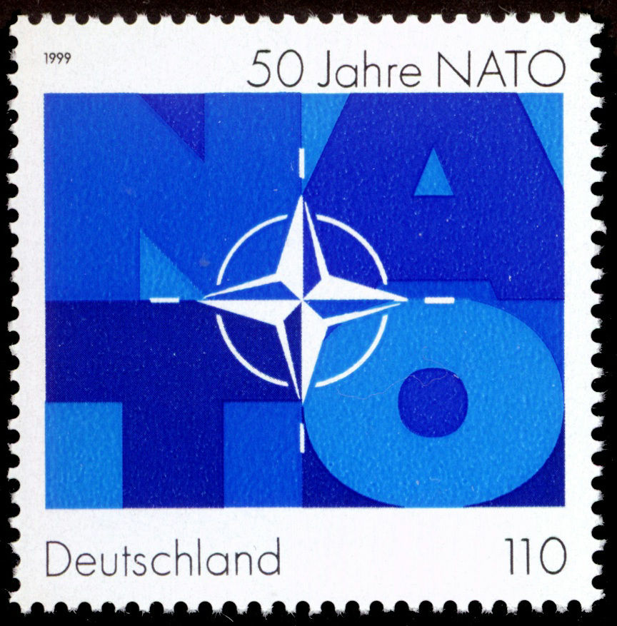 1999 German NATO stamp, a simple blue design with the NATO letters in large font