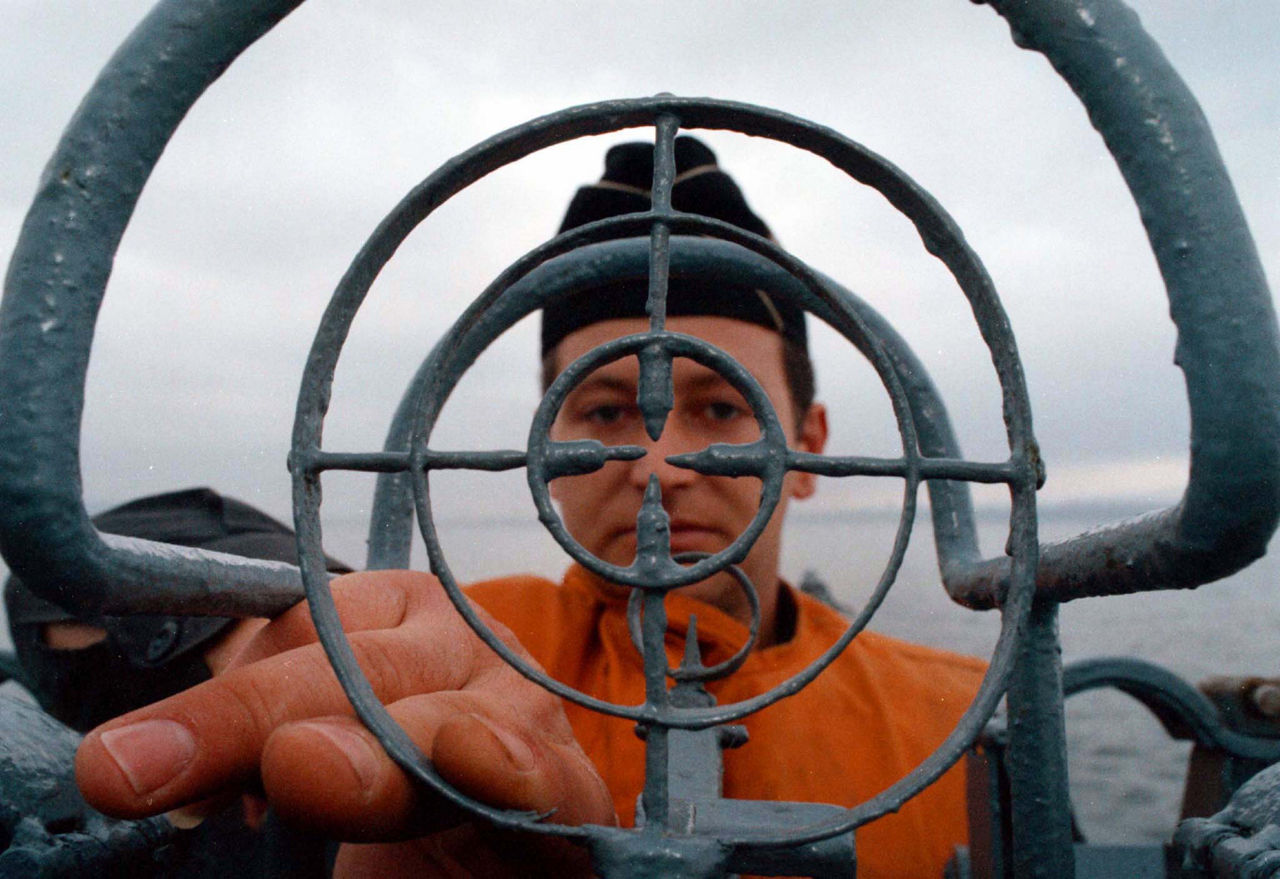 A sailor looks through an anti-aircraft targeting sight during a maritime exercise in the Black Sea, March 1999. (Photo © Reuters/STR New)