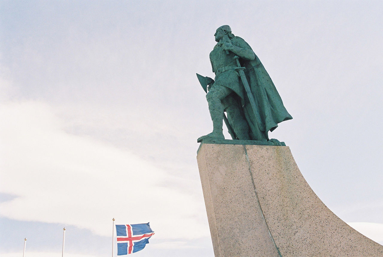A statue of Leif Erikson stands beside a billowing Icelandic flag during a meeting of NATO defence ministers in Reykjavik in May 2002. 