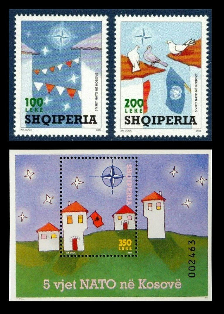 2004 Albanian NATO stamp, showing the NATO compass logo as a star in the sky over houses