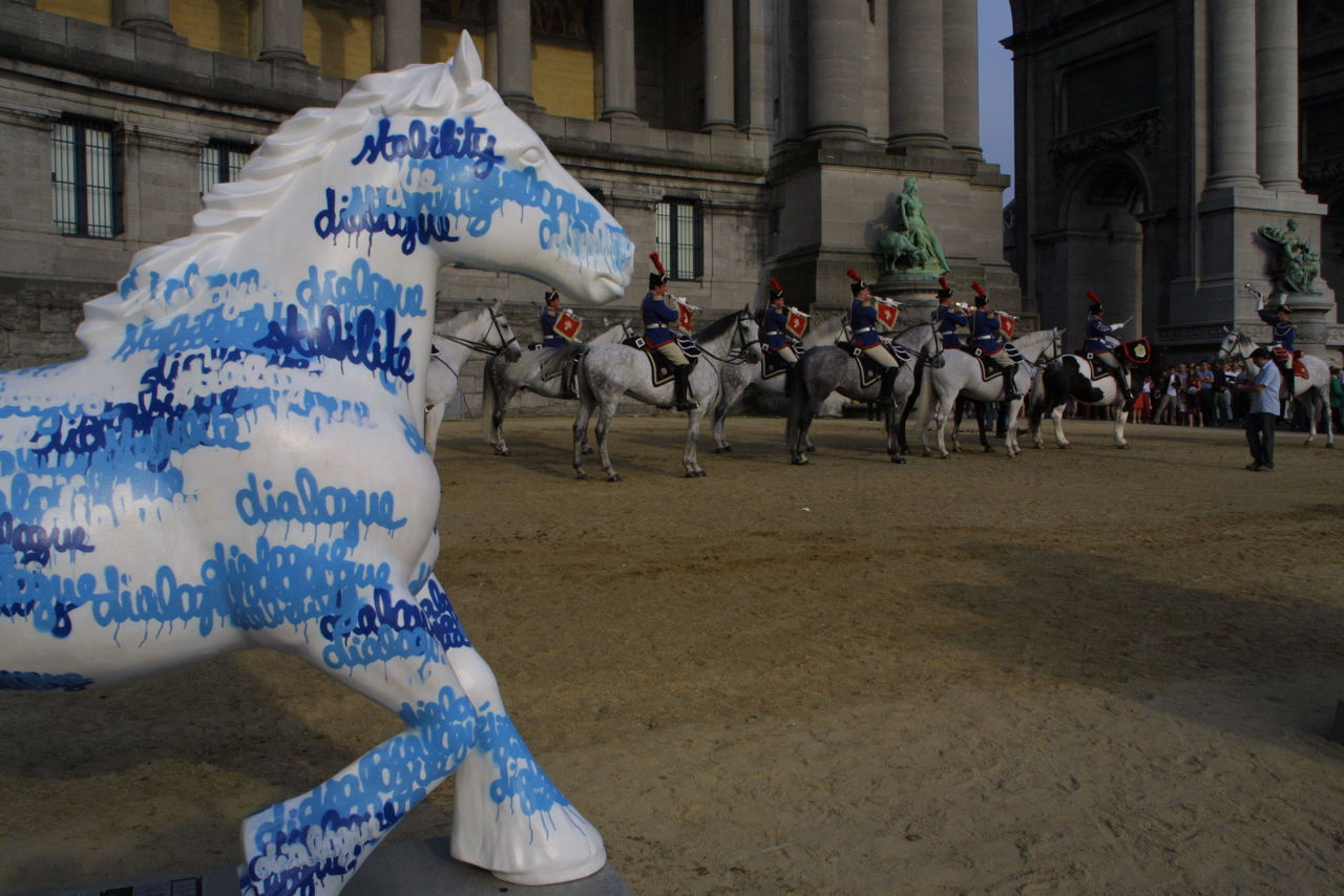 The NATO submission to the 2005 Belgian Horse parade – an art festival held in Brussels’ Parc du Cinquantenaire – stands on a plinth near a group of real horses. 