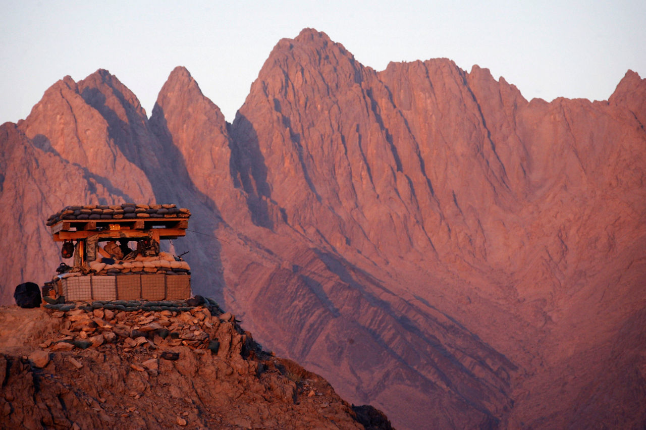 Soldiers keep a lookout at a remote hilltop outpost at Ma’sum Ghar base in southern Afghanistan. (Photo © Reuters/Finbarr O’Reilly) 