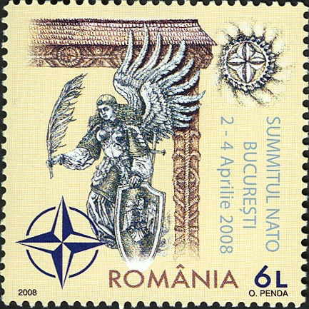 2008 Romanian NATO stamp, depicting an angel with a shield and a quill pen