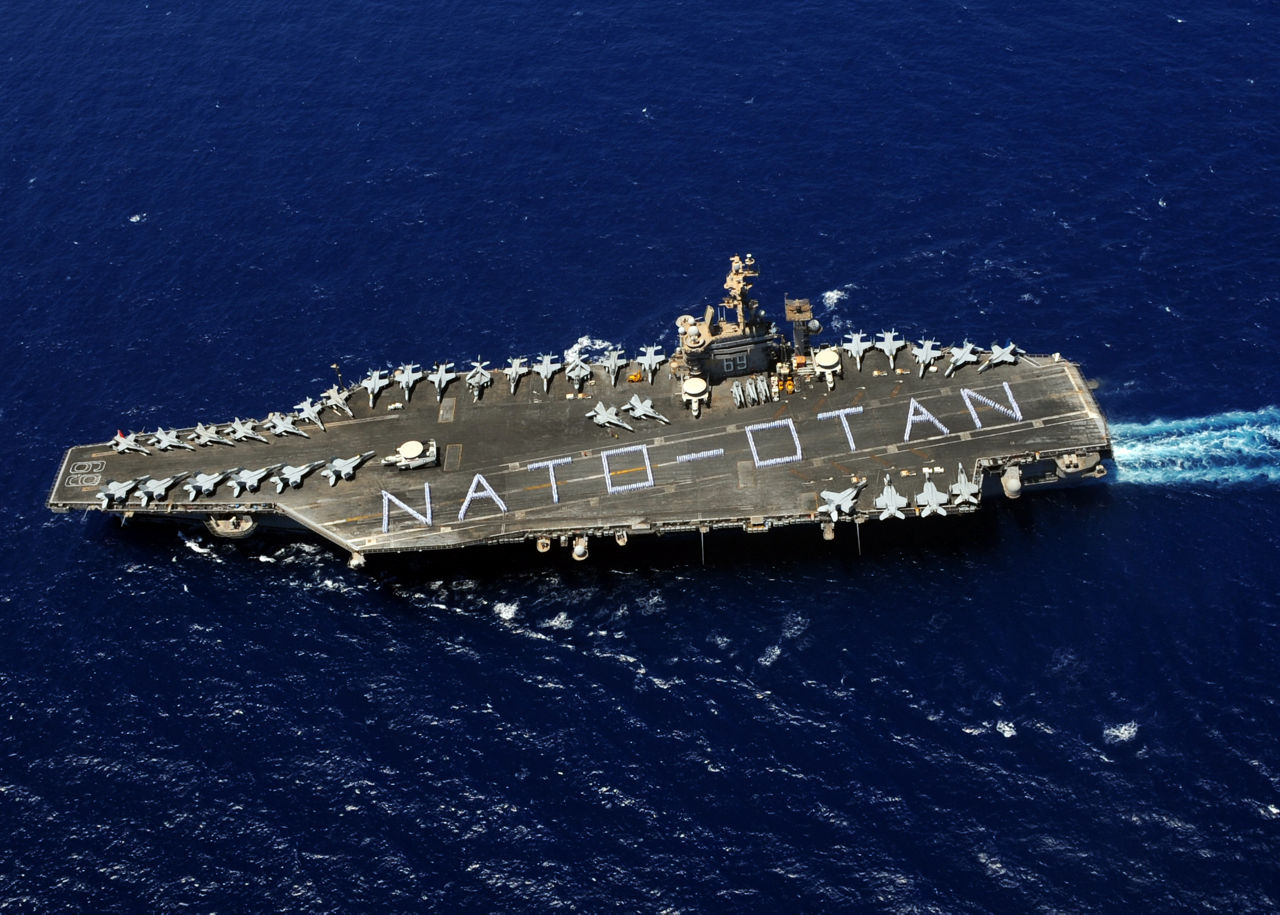 Sailors spell out ‘NATO-OTAN’ on the runway of the USS Eisenhower, an aircraft carrier named after NATO’s first Supreme Allied Commander Europe (SACEUR). 