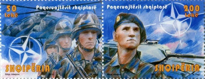 2009 Albanian NATO stamp, depicting peacekeeping troops under a NATO banner