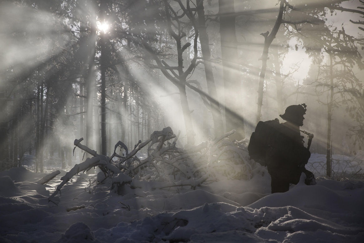 A soldier treks through the winter woods in a field training exercise during exercise Iron Sword 2016 at the Rukla Training Area in Lithuania. (Photo credit: Sgt. Kirstin Merrimarahajara, United States Marine Corps.)