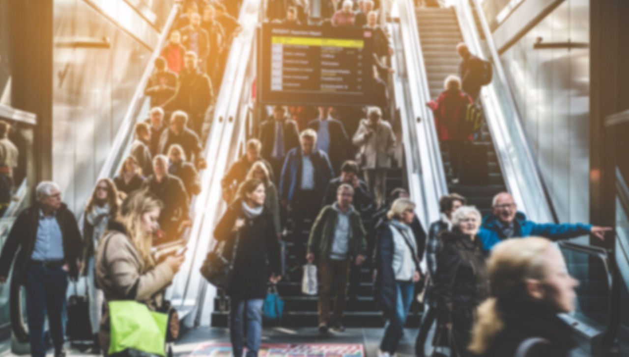 Berlin, Germany - april, 27: Traveling people on crowded escalator inside main train station (Hauptbahnhof) in Berlin.