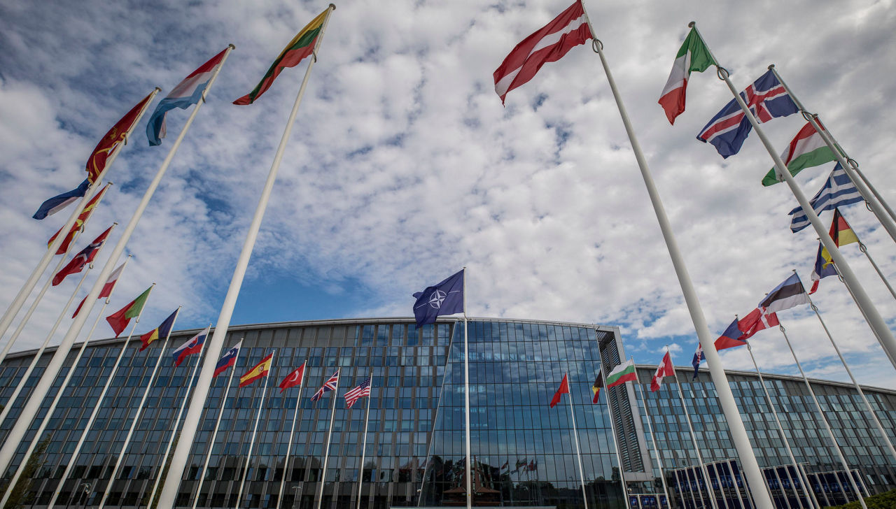 Shots of NATO Flags and sculpture