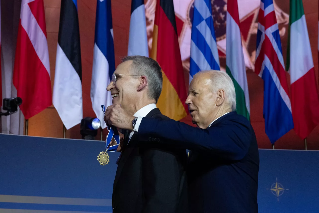 Left to right: NATO Secretary General Jens Stoltenberg is awarded a medal by US President Joe Biden