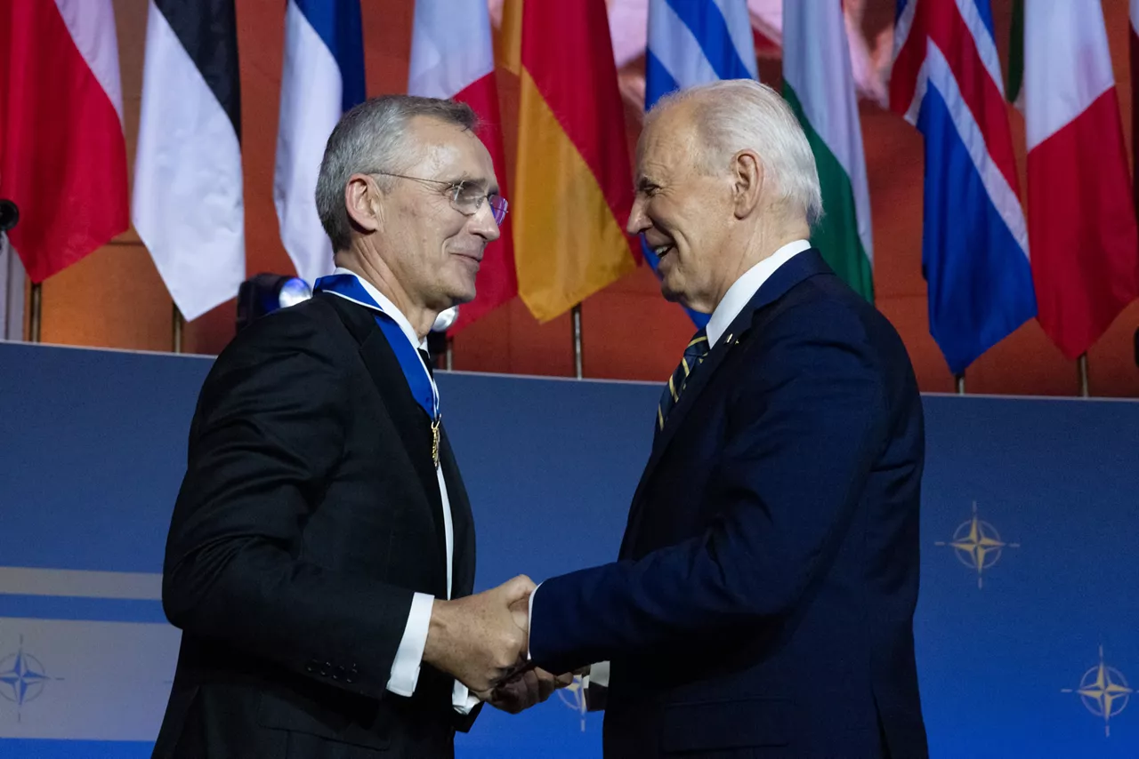 Left to right: NATO Secretary General Jens Stoltenberg is awarded a medal by US President Joe Biden