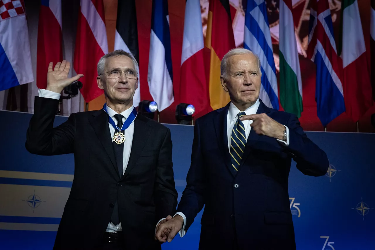 Left to right: NATO Secretary General Jens Stoltenberg is awarded a medal by US President Joe Biden