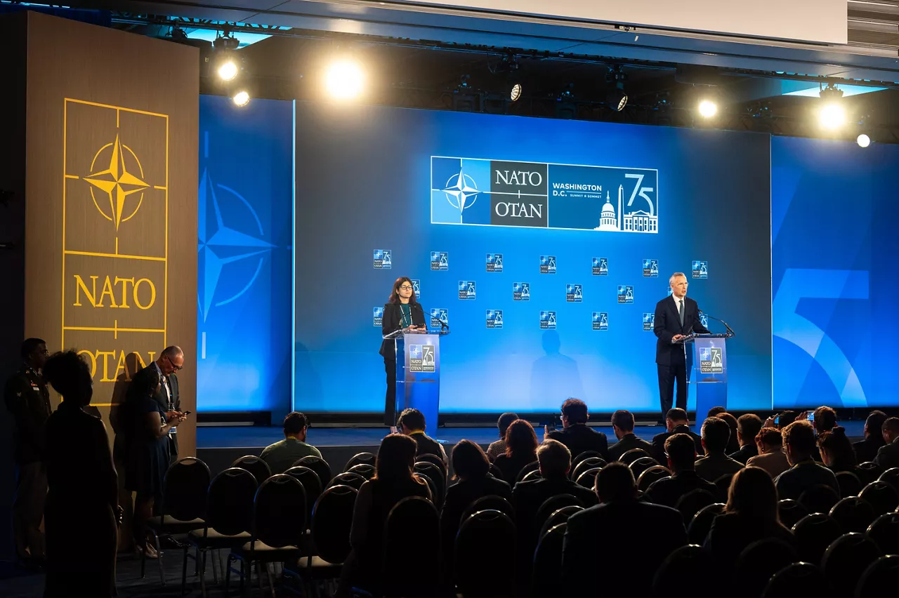 NATO Secretary General Jens Stoltenberg and NATO Spokesperson Farah Dakhlallah