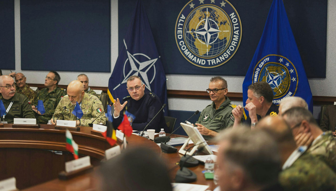 Supreme Allied Command Transformation Admiral Pierre Vandier speaks to the NATO Military Committee as the Chair of the NATO Military Committee, Admiral Giuseppe Cavo Dragone, and the Director General of the International Military Staff, Lieutenant General Janusz Adamczak, sit next to him.