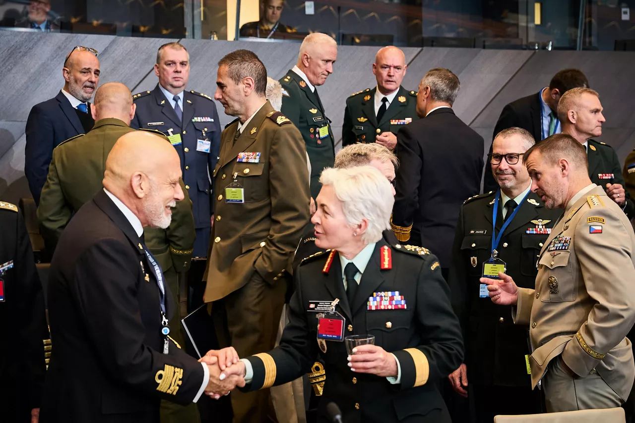 Chair of the NATO Military Committee, Admiral Giuseppe Cavo Dragone greeting the NATO Chief of Defence of Canada, General Jennie Carignan