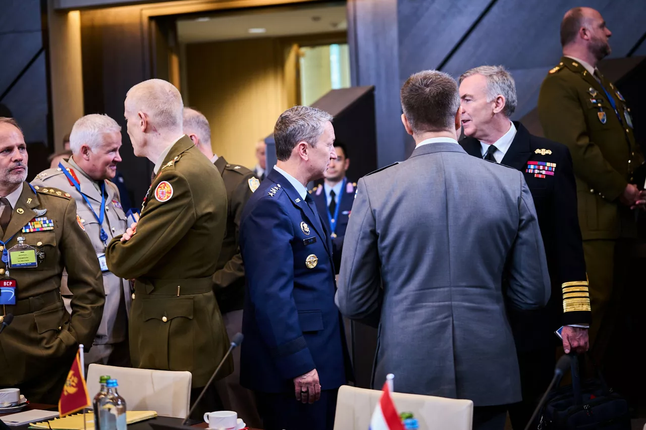 The NATO Chief of Defence of the United States of America, General Dan Caine talking to the NATO Chief of Defence of the United Kingdom, Admiral Sir Tony Radakin and the NATO Chief of Defence of Finland, General Janne Jaakkola