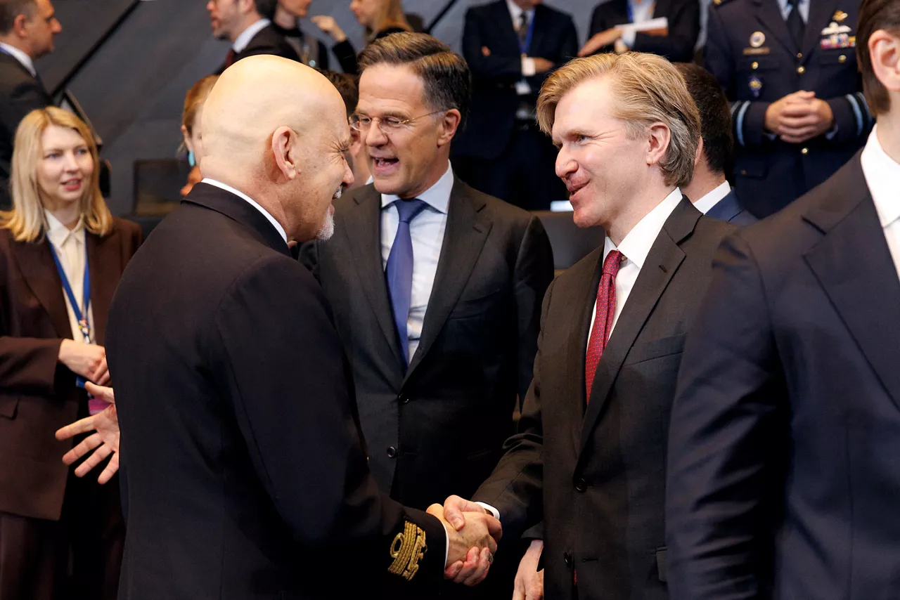 Chair of the Military Committee, Admiral Giuseppe Cavo Dragone shaking hands with Elbridge A. Colby (US Under Secretary of War)