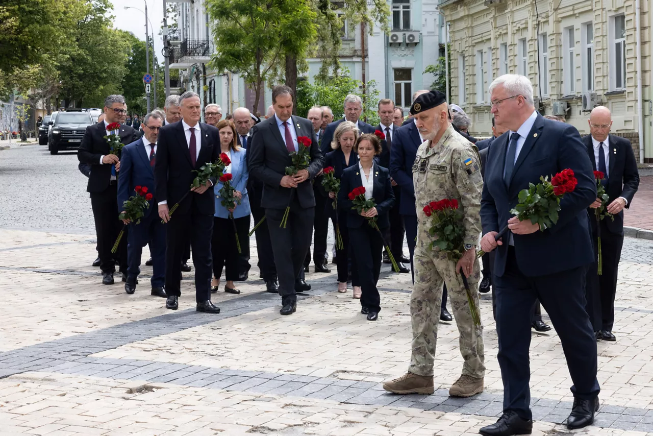 Chair of the Military Committee Admiral Giuseppe Cavo Dragone and Andrii Sybiha, Minister of Foreign Affairs of Ukraine in a wreath-laying ceremony at the Wall of Remembrance of the Fallen for Ukraine