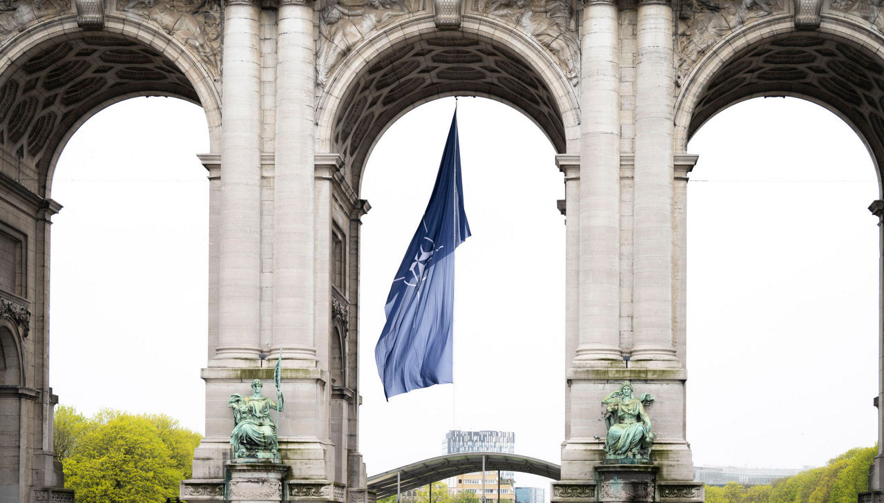 Monuments throughout the Brussels are marking NATO’s anniversary. In Parc du Cinquantenaire, the NATO flag is flying under the Memorial Arch