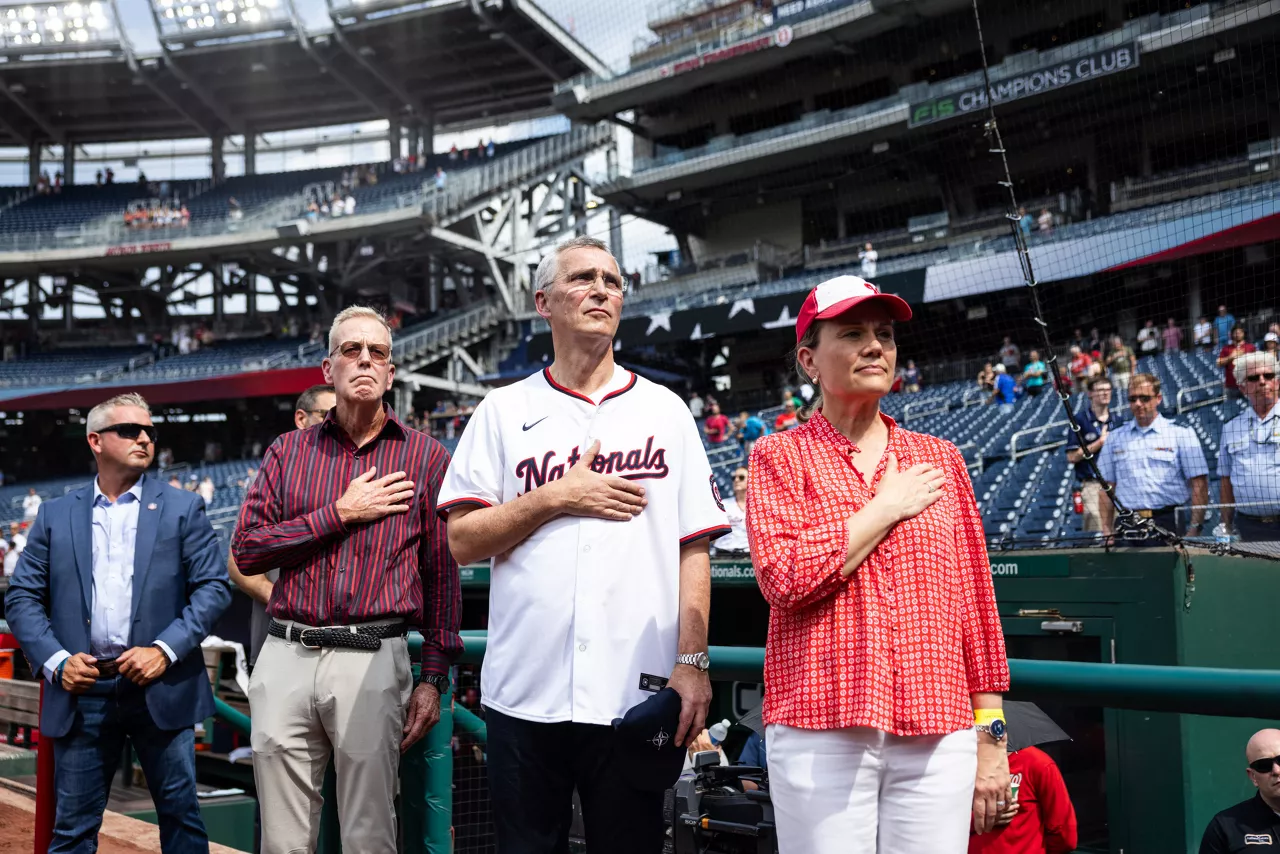 NATO Secretary General Jens Stoltenberg and Permanent Representative of the United States to NATO, Julianne Smith during the US National Anthem