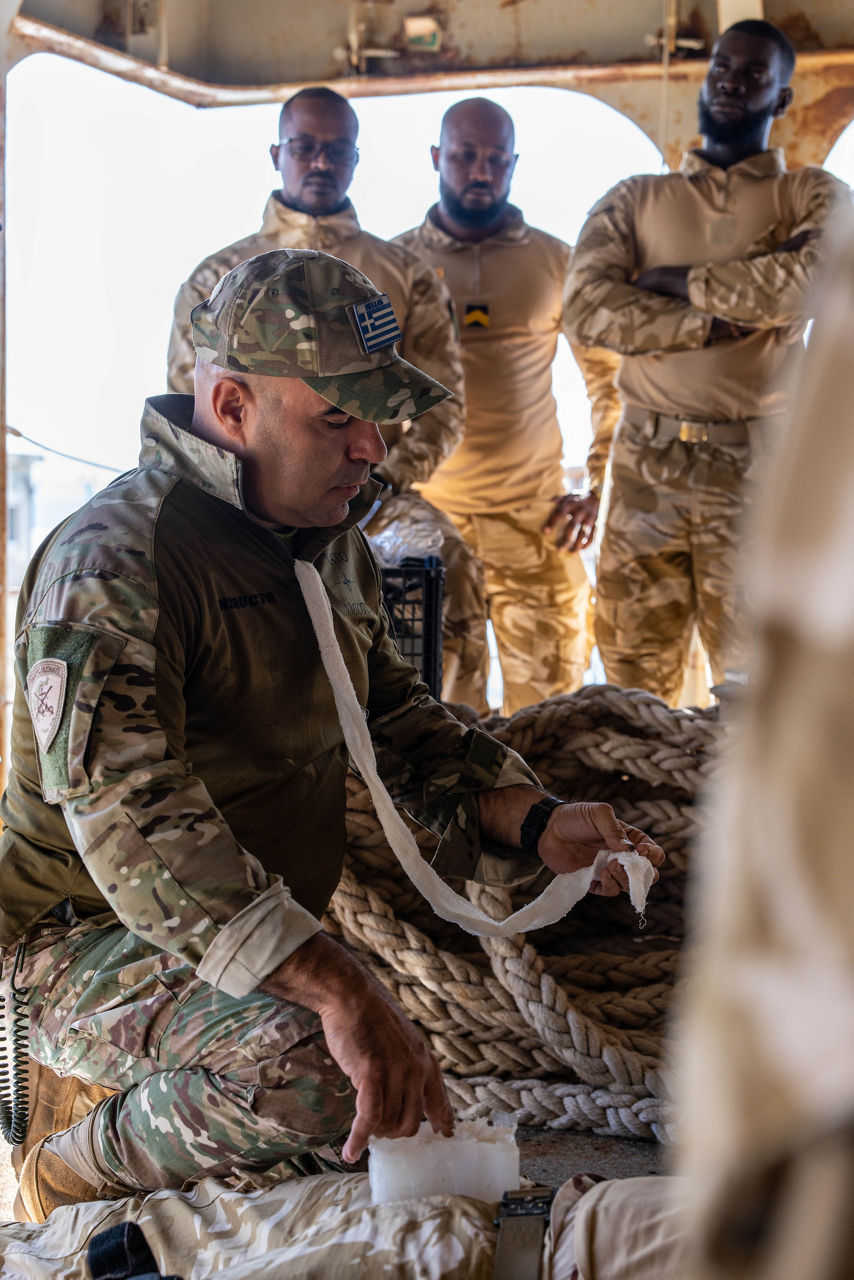 NATO trainer instructs Mauritanian sailors in first aid techniques.

Sailors of the Mauritanian Navy conducted a three week-training programme on maritime security operations, hosted by the NATO Maritime Interdiction Operational Training Centre (NMIOTC), located near Chania, Greece, from 21 October to 8 November 2024. These training activities were carried out within the framework of NATO’s Defence and Related Security Capacity Building (DCB) Initiative.

