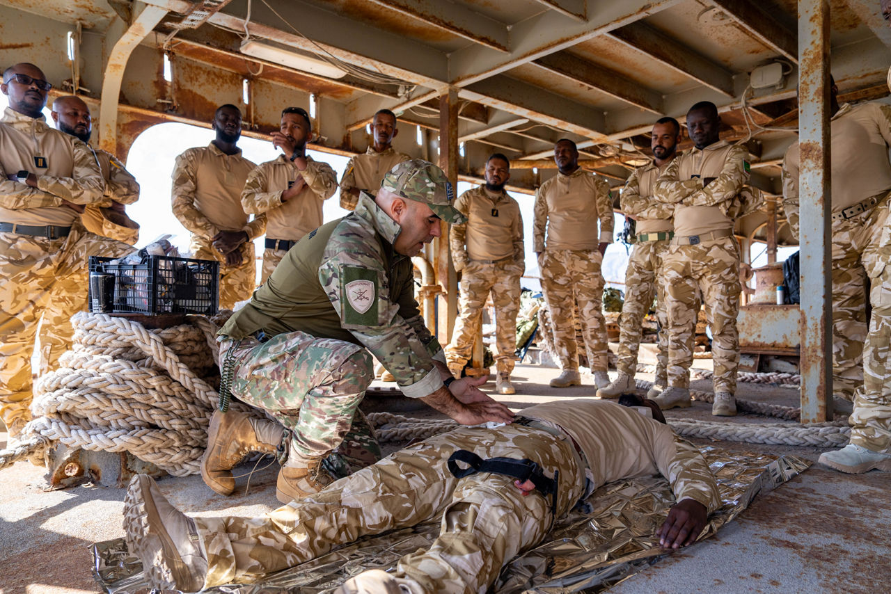 NATO trainer instructs Mauritanian sailors in first aid techniques.

Sailors of the Mauritanian Navy conducted a three week-training programme on maritime security operations, hosted by the NATO Maritime Interdiction Operational Training Centre (NMIOTC), located near Chania, Greece, from 21 October to 8 November 2024. These training activities were carried out within the framework of NATO’s Defence and Related Security Capacity Building (DCB) Initiative.

