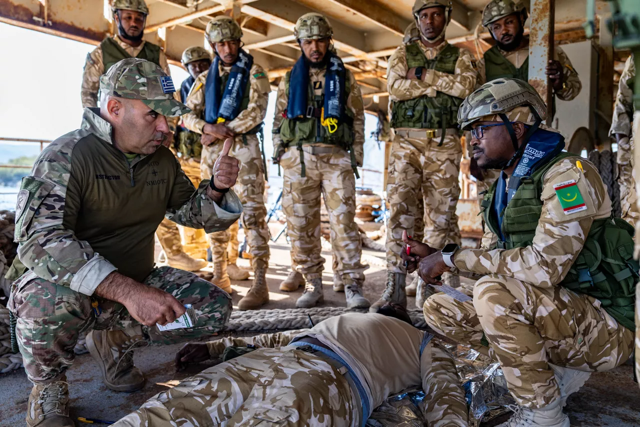 NATO trainer instructs Mauritanian sailors in first aid techniques.



Sailors of the Mauritanian Navy conducted a three week-training programme on maritime security operations, hosted by the NATO Maritime Interdiction Operational Training Centre (NMIOTC), located near Chania, Greece, from 21 October to 8 November 2024. These training activities were carried out within the framework of NATO’s Defence and Related Security Capacity Building (DCB) Initiative.

