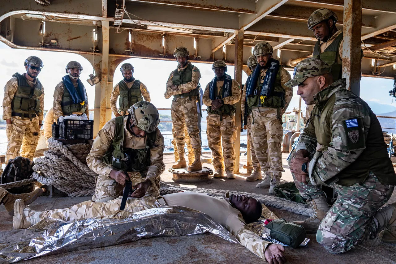 NATO trainer instructs Mauritanian sailors in first aid techniques.



Sailors of the Mauritanian Navy conducted a three week-training programme on maritime security operations, hosted by the NATO Maritime Interdiction Operational Training Centre (NMIOTC), located near Chania, Greece, from 21 October to 8 November 2024. These training activities were carried out within the framework of NATO’s Defence and Related Security Capacity Building (DCB) Initiative.

