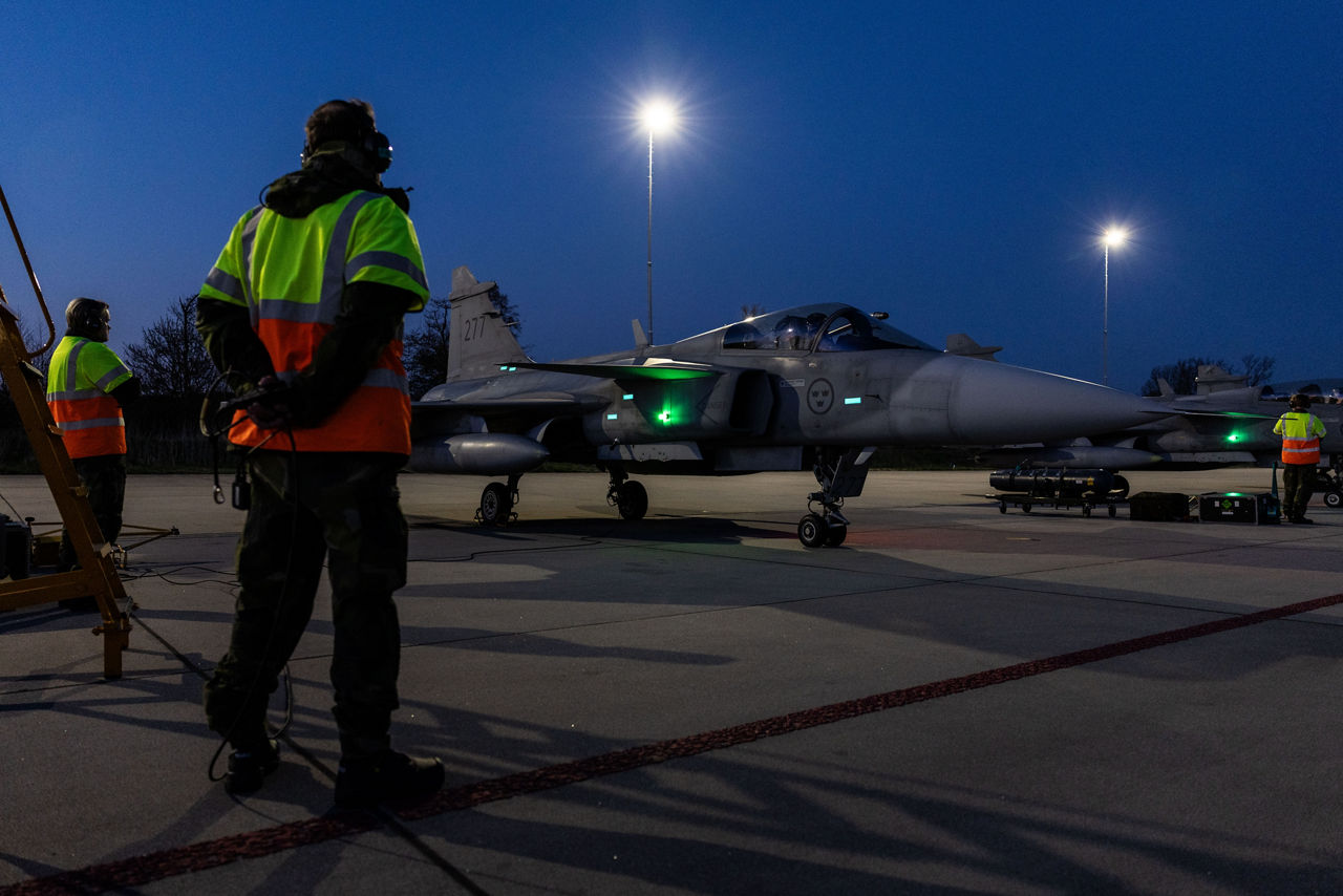 Ground crew from the Swedish Air Force stand by as JAS 39 Gripen fighters prepare to taxi for takeoff at Leeuwarden Air Base in the Netherlands during exercise Ramstein Flag 25. 

With over 90 aircraft from 15 NATO Allies flying out of 12 Allied air bases throughout Europe, the exercise tests NATO’s ability to perform a broad variety of air combat missions using multinational forces.