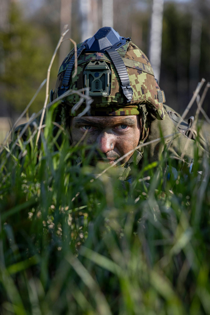 A close-up of an Estonian soldier as he looks through the grass during exercise training. 

Estonia hosted one of the largest military exercises in its history. Known as exercise Hedgehog 25 — or Siil 2025 in Estonian — the operation saw 16,000 troops take part in a sweeping, multinational defence drill that spans the entire country.  It’s a test of how Estonia and other NATO Allies would respond together in the face of a crisis.