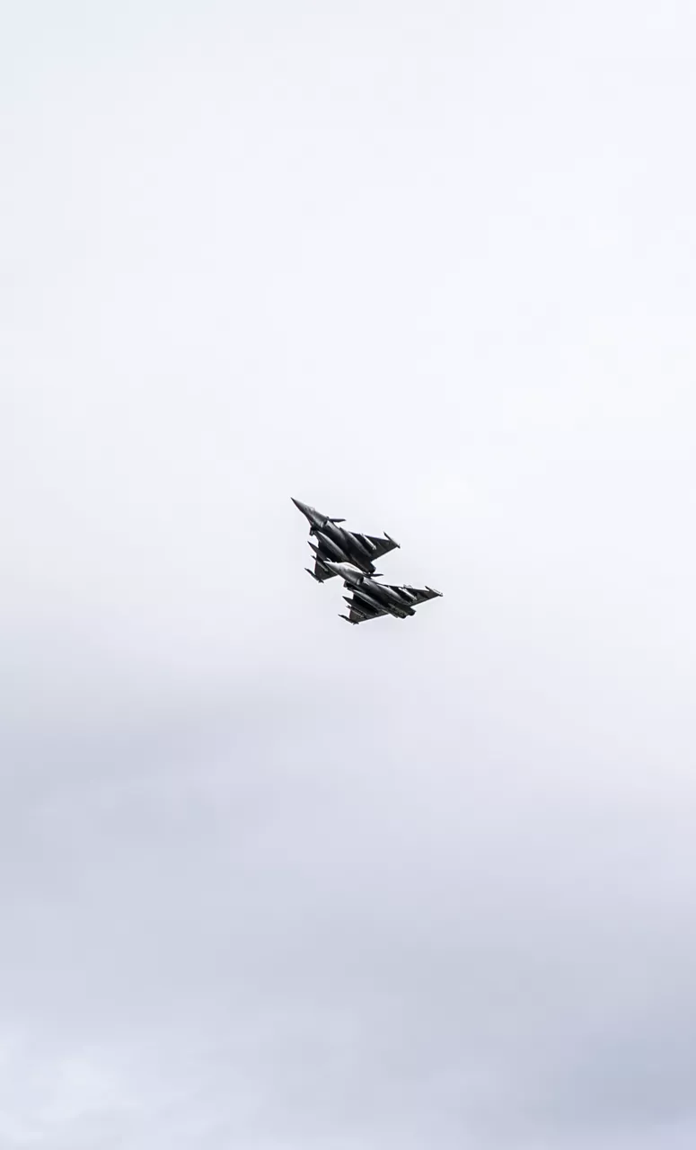 Two Rafale multirole fighter jets from the French Air Force perform a flyby over a runway in Poland. In the wake of the intrusion of Russian drones to Polish airspace on 10 September 2025, the French Air Force has deployed three Rafale fighter jets to Poland as part of the new NATO activity “Eastern Sentry”.