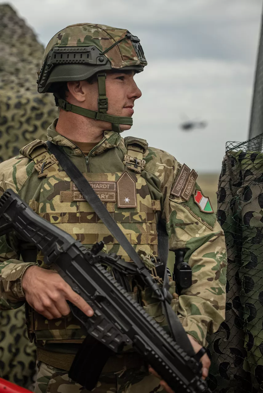 A Hungarian soldier stands guard at a fuel depot. Exercise Adaptive Hussars 2025 was the Hungarian Defence Forces’ largest and most complex military exercise since Hungary’s accession to NATO in 1999. It promoted cooperation between all NATO members contributing to the NATO’s multinational battlegroup in Hungary, and boosted Hungary’s  defence capabilities along with NATO defence plans and procedures.